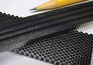 Fig 1 Typical honeycomb sections: machined (0.031 in. cell size) and as-manufactured (0.062 in. cell size)