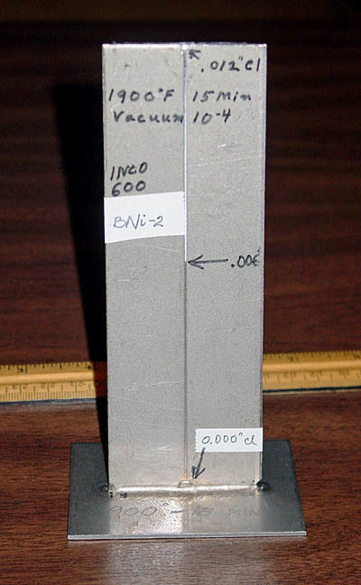 Fig. 2. Vertical Test Specimen (VTS) made from Inconel 600 and brazed with BNi-2 nickel-based brazing filler metal (BFM). The gap clearance is 0.000" (i.e. the metals touch) at the base and gradually opens up to a 0.012" (0.30mm) clearance at the top. Note the capillary break at a gap clearance of 0.006" (0.15 mm). During the furnace brazing cycle, the liquid BNi-2 filler metal flowed and was pulled upwards by capillary action until the gap was 0.006" (0.15mm), at which point it could rise no further.