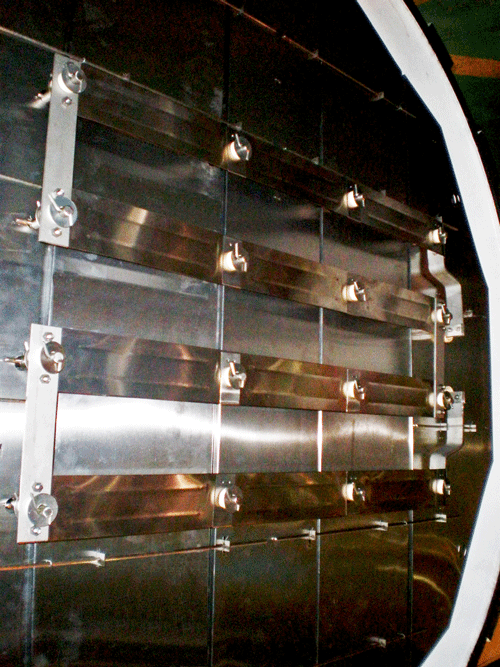 A typical horizontal aluminum vacuum furnace with heating elements on the front and rear of the furnace (door and back wall of the chamber).
