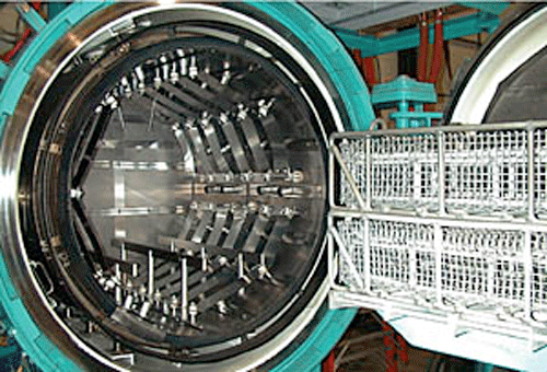 Baskets containing parts for heat treating ready for loading into the furnace.