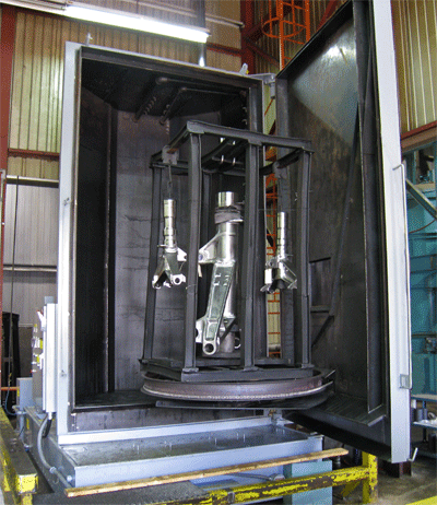 Parts washer used to remove machining residue prior to vacuum heat treating.