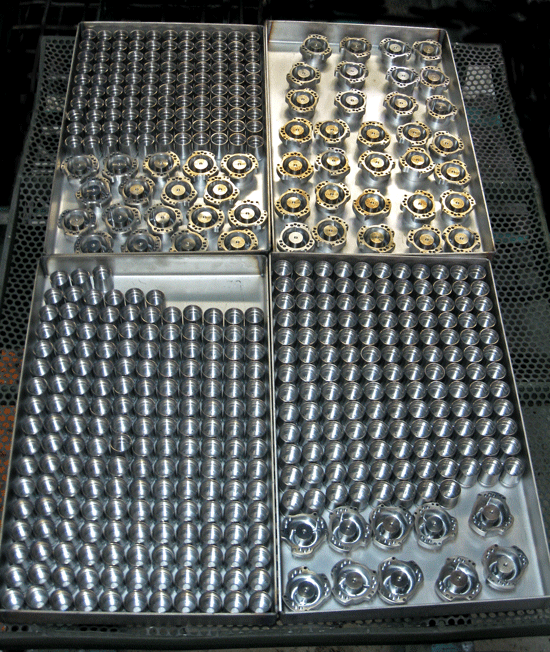 Die parts loaded for vacuum hardening.