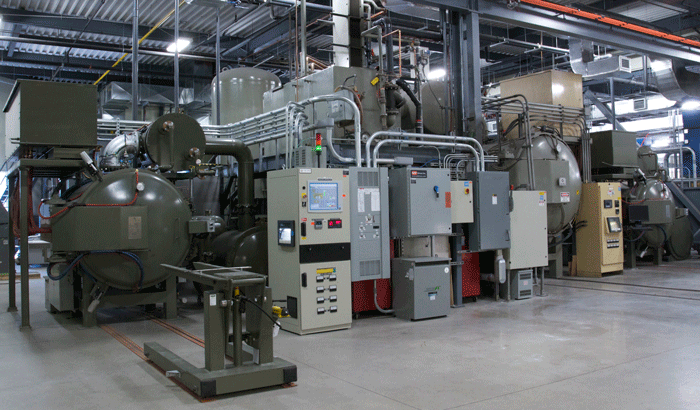 Fig. 2 - Typical Vacuum Furnace Shop - (a) Vertical Style Vacuum Furnace - (Photograph Courtesy of VAC AERO) (b) Horizontal Style Vacuum Furnaces