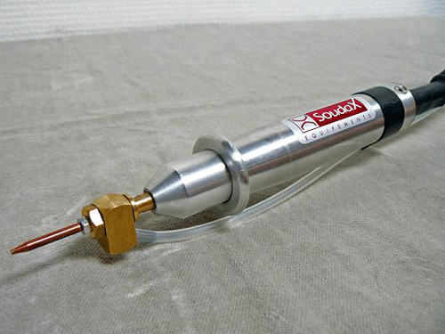 Figure 6. Handheld capacitive discharge resistance spot welder with an attached air-hose to hold “BB” in place in front for fixturing via ball-tack technique.