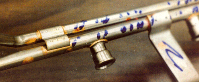 Figure 1 -- Copper brazed fuel-rail made from low-carbon steel. Note lack of copper brazing filler metal (BFM) in the gap between the two steel tubes, and the broken bracket-projection-weld (left side of photo). Bracket has pulled away from the lower tube due to expansion/contraction issues.