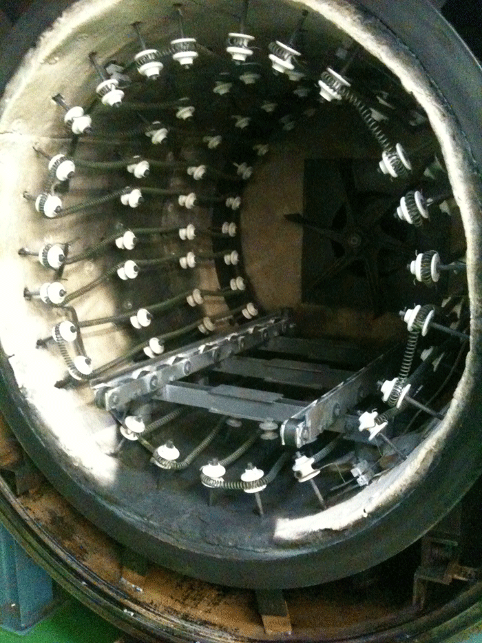 Figure 1 - Oil soaked insulation in a vacuum tempering furnace (oil introduced with product).