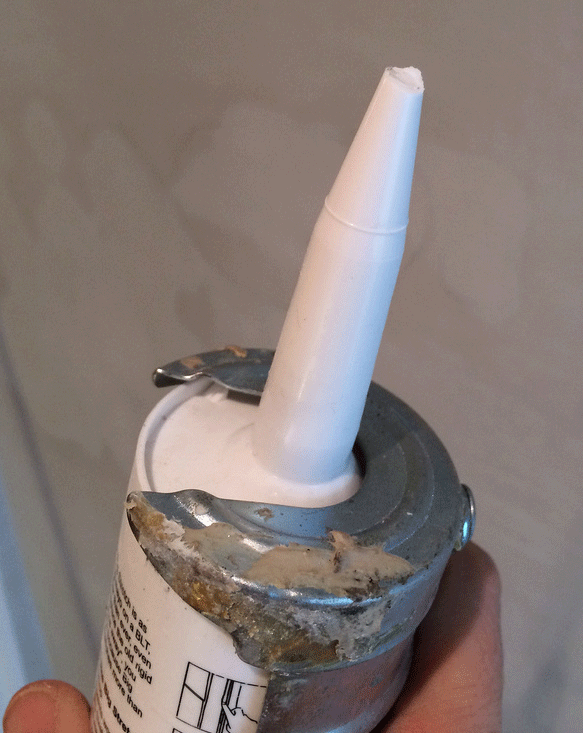 Figure 2. Note that caulking cartridges use tapered plastic tips to extrude the paste because the caulk is thick and very viscous. A tapered tip allows the thick paste to extrude much more easily.