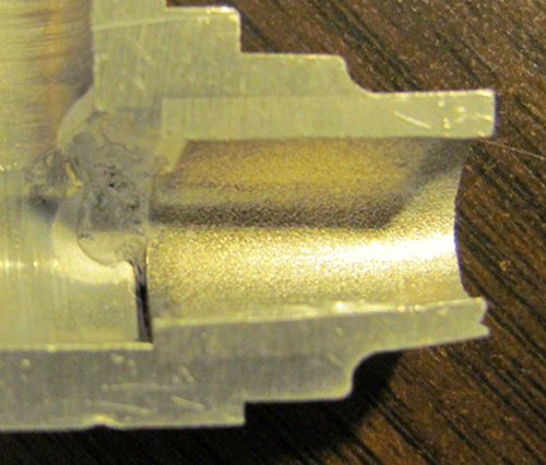 Fig. 1 -- Tube-In-Fitting joint showing reasonable penetration of joint by the brazing filler metal (BFM). Notice the small, concave shape of the braze fillet on outside of joint (at right side).