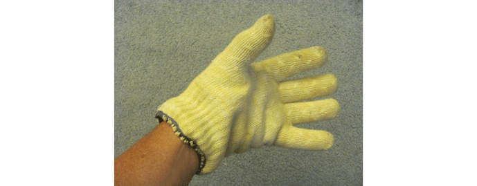 Fig. 4 A heavy-duty cotton glove with silicon beads on surface to protect hands from heat. More bulky than the gloves shown in Fig. 2b, but much safer for handling hot metal.