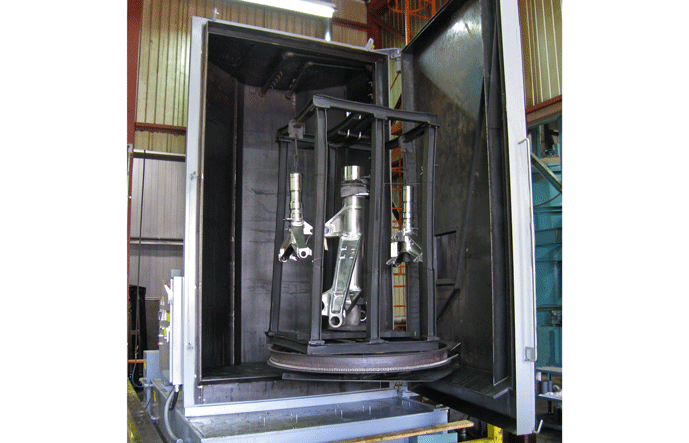 Parts washer used to remove machining residue prior to vacuum heat treating.