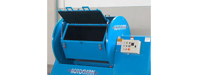 Fig. 1 -- a deburring machine in which the parts are loaded into the container, the lid is closed and locked, and then the drum is rotated to cause the tumbling of the parts inside the container. (Photo courtesy of Sideros Engineering)