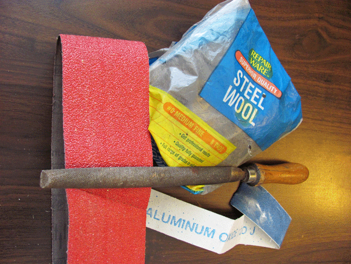 Fig. 1 Tools some shops use to roughen surface of parts for brazing (coarse and fine-grit emery paper, steel wool, and a course file).