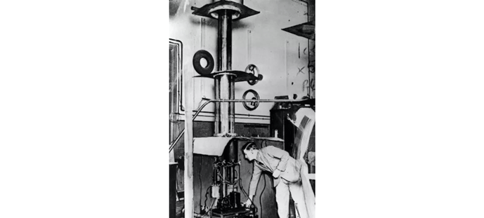 Figure 3 | John Cockcroft adjusts the vacuum pump on the first particle accelerator in the Cavendish Laboratory at Cambridge University4