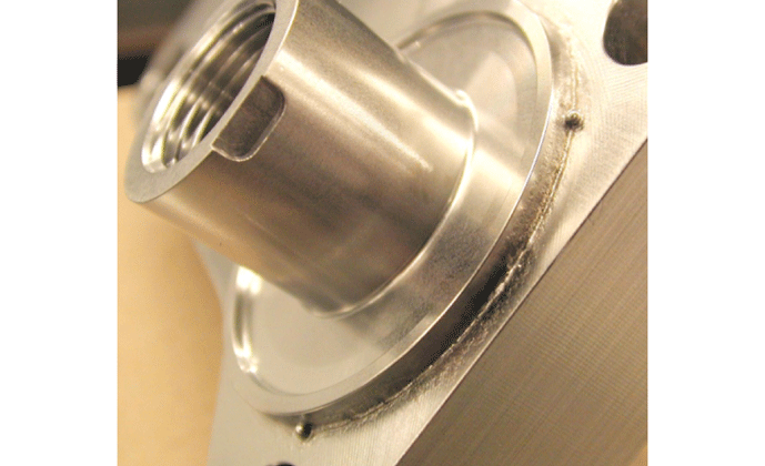 Fig. 4 Ball-tack fixturing (three BB’s placed at 120-degree increments around the periphery). These ultra-tiny welds leave virtually no oxides and zero distortion.