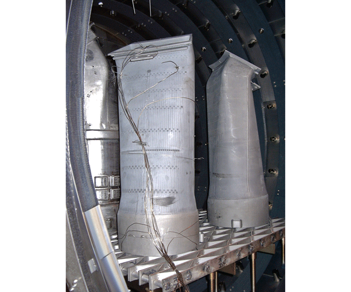 Fig. 4 Load thermocouples (sheathed) are shown attached to large components in a furnace load in order to effectively monitor the temp of various sections of each part in that load. (Photo courtesy VacAero, Oakville, Ontario, Canada)