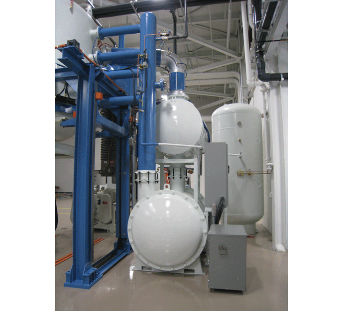 (b) Physical hardware – blower and heat exchanger arrangement on a vertical vacuum furnace