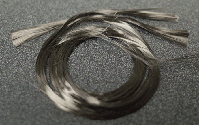 Fig. 1 Long fibers of carbon that are used in making C/C structures. Photo courtesy of Across USA, Inc., Carson, CA.