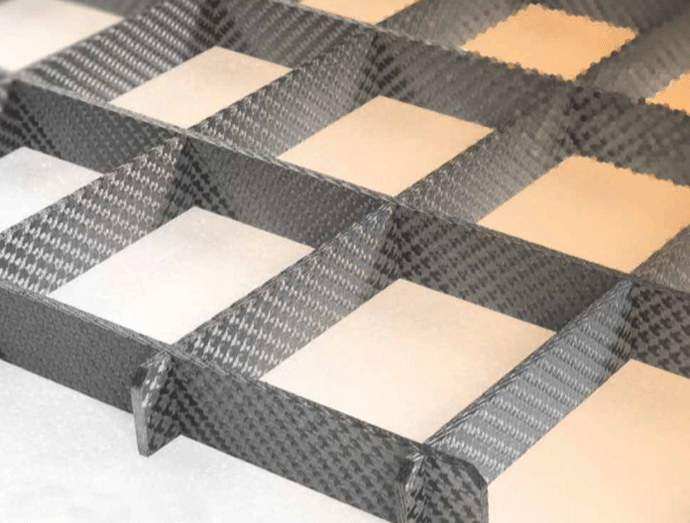 Fig. 2 - The C/C material shown here as thick strips assembled in a grid-pattern, creating a very strong work-piece carrier. Photo courtesy of Schunk Graphite, Menomonee Falls, WI.