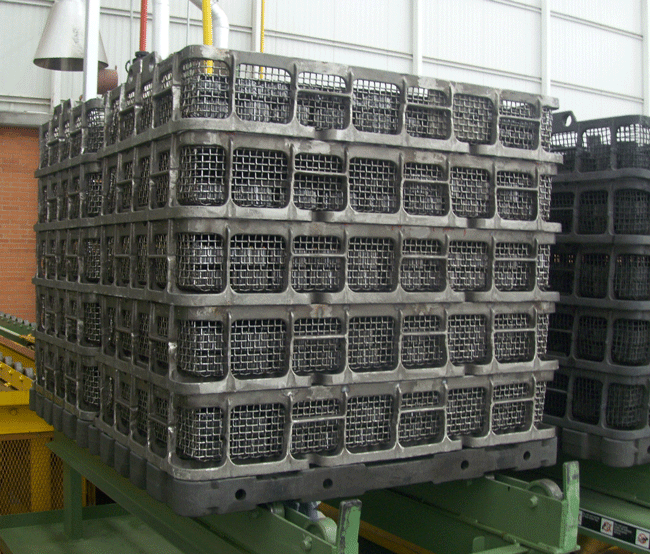 Figure 17 - Typical Alloy Stacking Baskets Atop Carrier Grid (Photograph Courtesy of AFE Cronite Technologies)