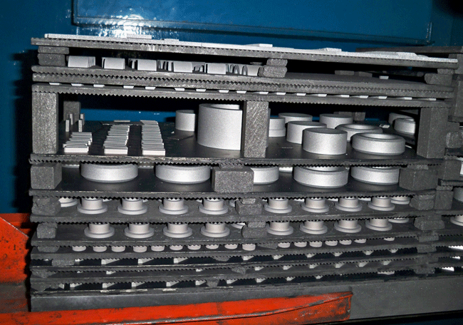 Figure 18 Typical Graphite Fixtures for Tungsten Carbide Sintering (Photograph Courtesy of AVS)