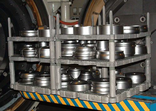 Figure 12 Typical Loading Arrangement for Parts Placed Directly Onto a Grid - (a) Alloy Fixture.
