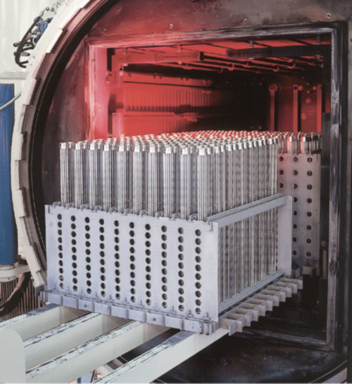 (b) Truck Heat Exchangers Placed on Carbon/Carbon Composite Fixtures for Vacuum Brazing. (Photograph Courtesy of Schunk Graphite Technology, LLC)