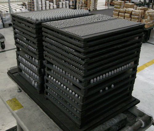 (c) Cemented Carbide Drill Bit Inserts Placed on Graphite Plates.