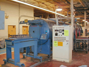 Figure 4 - Typical Semi-Continuous Vacuum Furnace - (Photograph Courtesy of C. I. Hayes)