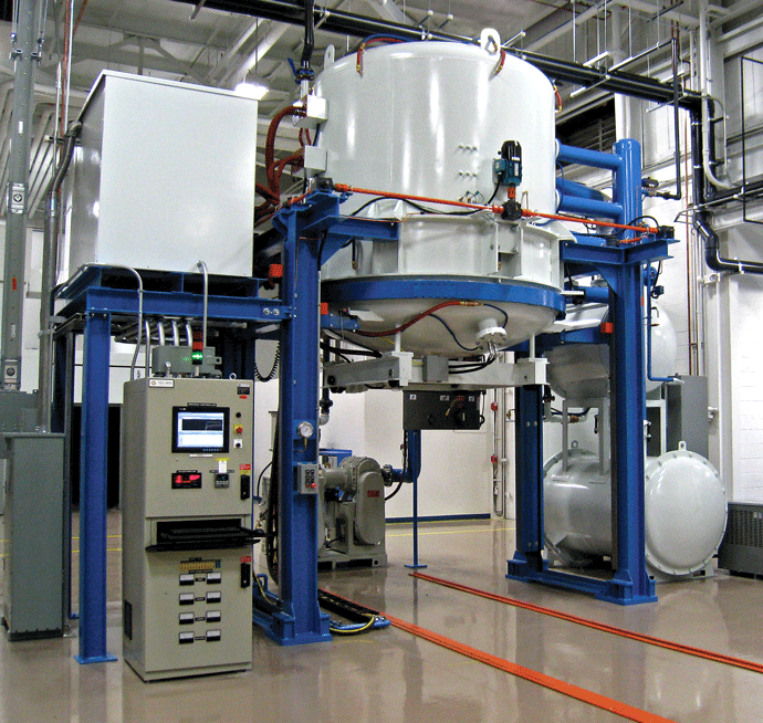 Figure 1: Vertical vacuum furnace with gas pressure quenching capability: (a) Typical Installation