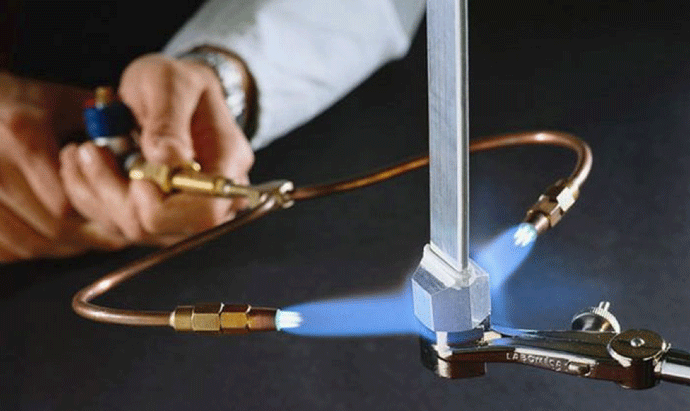 Fig. 4 The use of a dual-tip torch, with rose-bud (multi-flame) tips on each arm is ideal for brazing larger tubes and fittings.